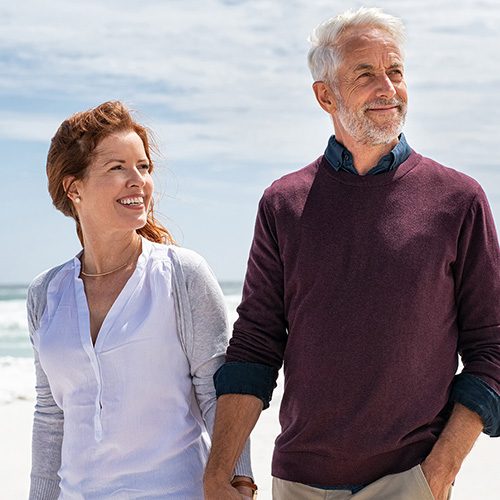 Happy,Senior,Couple,Holding,Hands,At,Beach,In,A,Sunny Personalized Health Solutions for a Vibrant Life